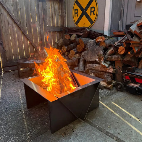 Customer fire pit with tall flames on a patio
