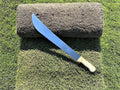 a machete with sod roll for cutting sod pieces rolls and slaps when installing sod