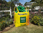 Yellow SOIL3 Humus Compost bag in a garden setting with flowers and plants.