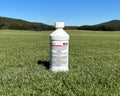 bottle of surfactant to help with herbicide in weed control